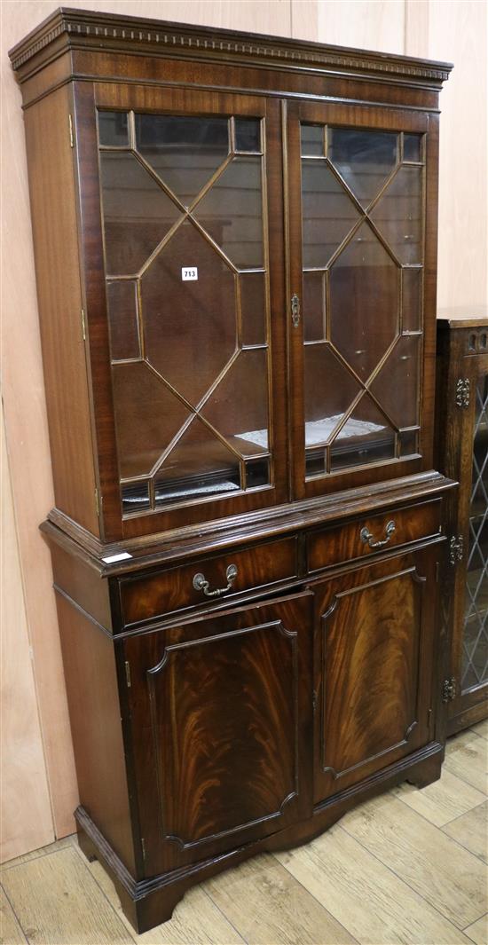 A George III style mahogany bookcase/cupboard, H.177cm